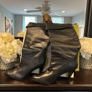 Vintage NWOT black leather knee-high women’s boots stiletto heel pointed toe